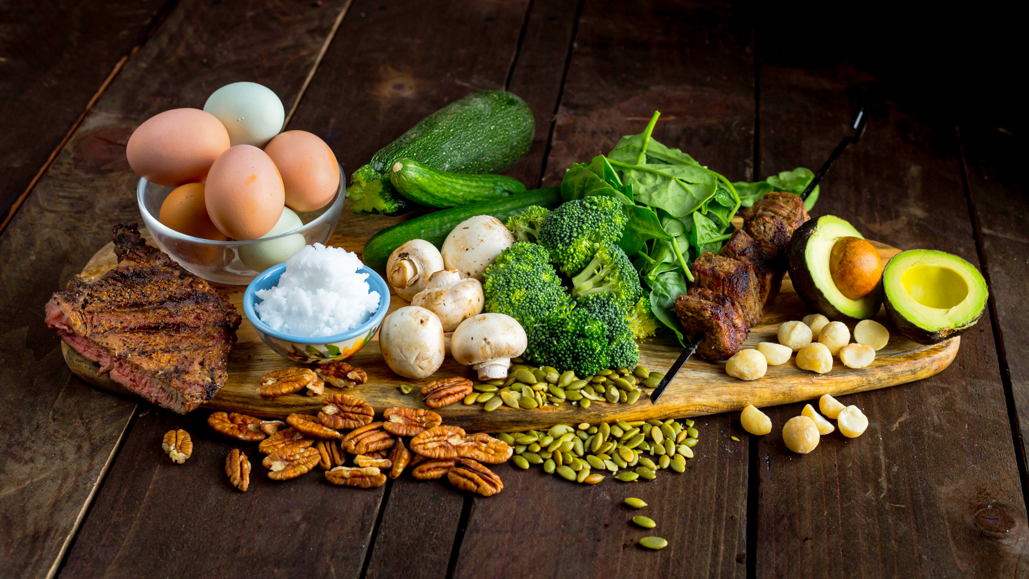 Attractive display of healthy fats from a ketogenic diet on a rustic wooden table. Iron-rich