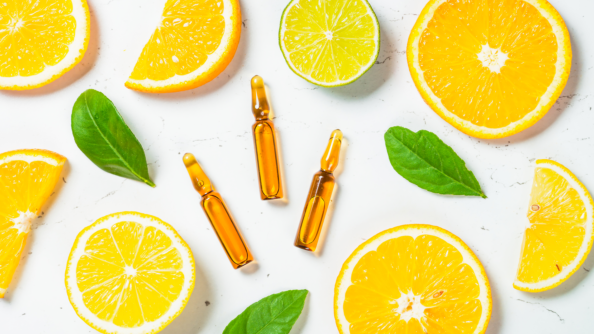 Vitamin C. Cosmetic products and fresh citrus fruits. Vitamin C